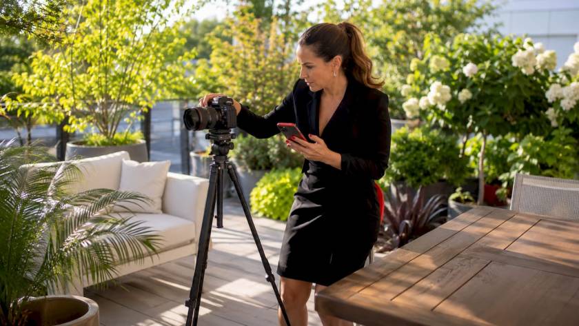Photographer preparing cohesive corporate photoshoot setup