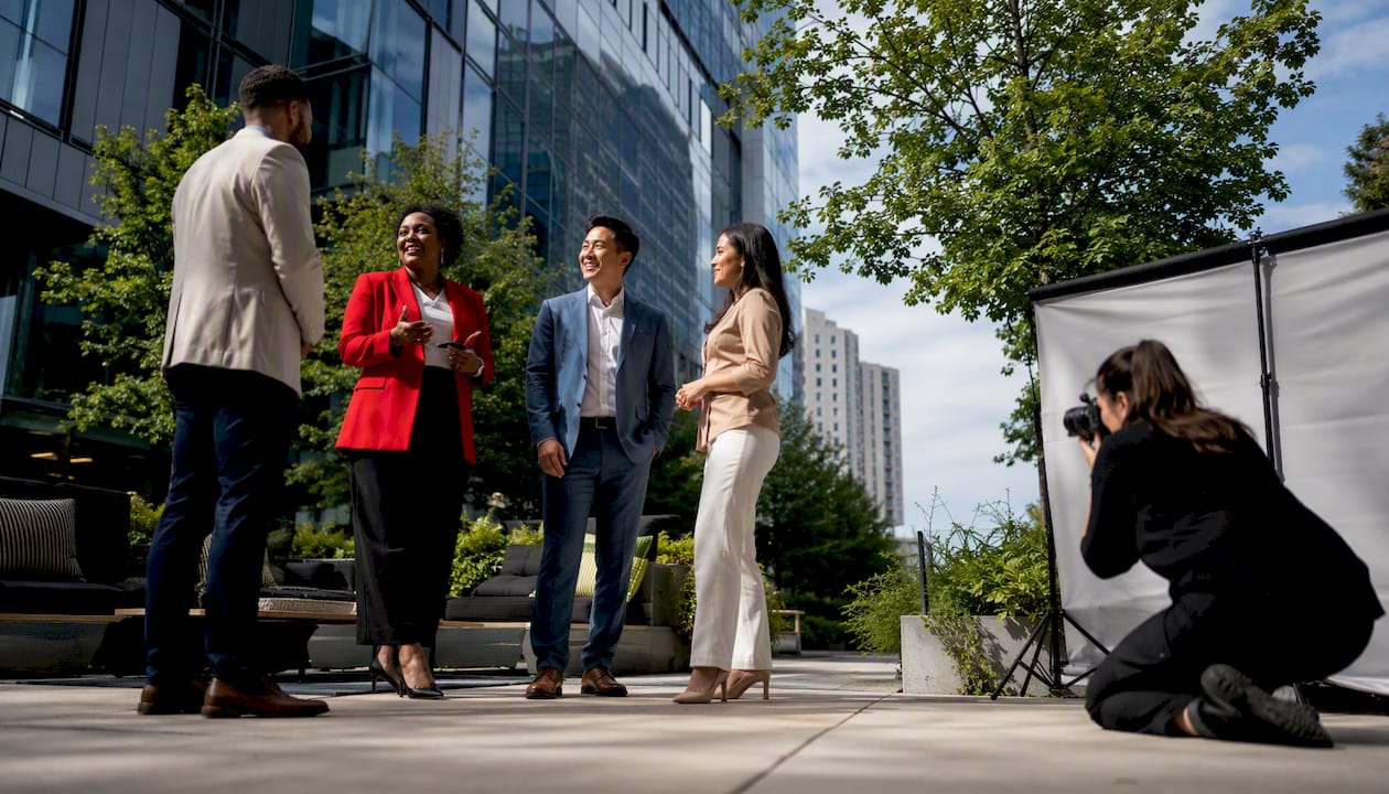 Business leaders preparing for corporate photography session