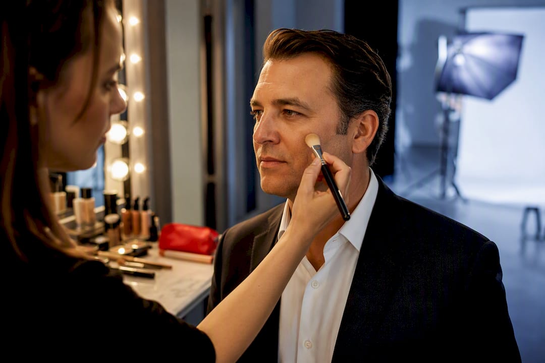 Makeup artist applying headshot makeup
