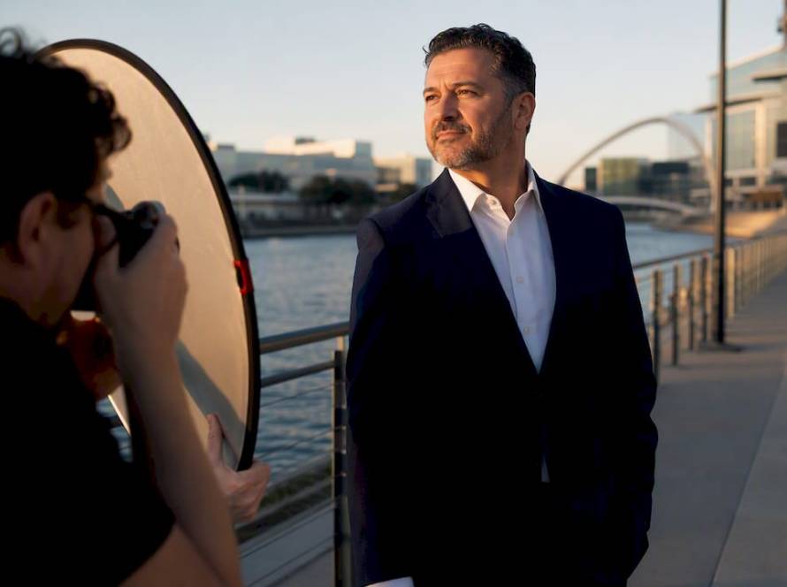 Photographer creating outdoor executive headshot