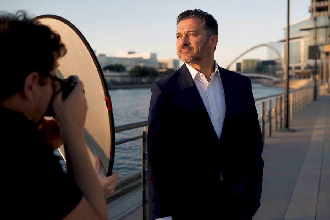 Photographer creating outdoor executive headshot